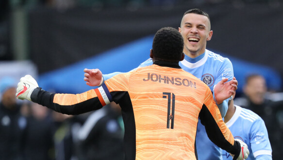 Keeper Hero: Shawn Johnson saved two penalties in the penalty shootout.  Here with Alfredo Morales.  Photo: Jaime Valdez