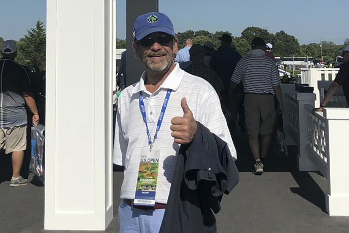 THUMB UP: A photo of Thomas Randelli at the entrance to the Open golf tournament at Shinnecock Hills Golf Club in 2018. Photo: Bob Van Wert/AP