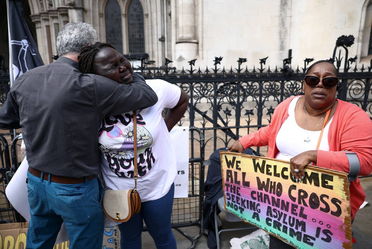 Activists demonstrate against the refugee agreement with Rwanda outside a British courtroom.