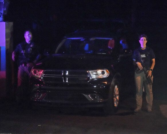 Research: Armed Secret Service agents stand guard during a search.  Photo: Wilfredo Lee AP